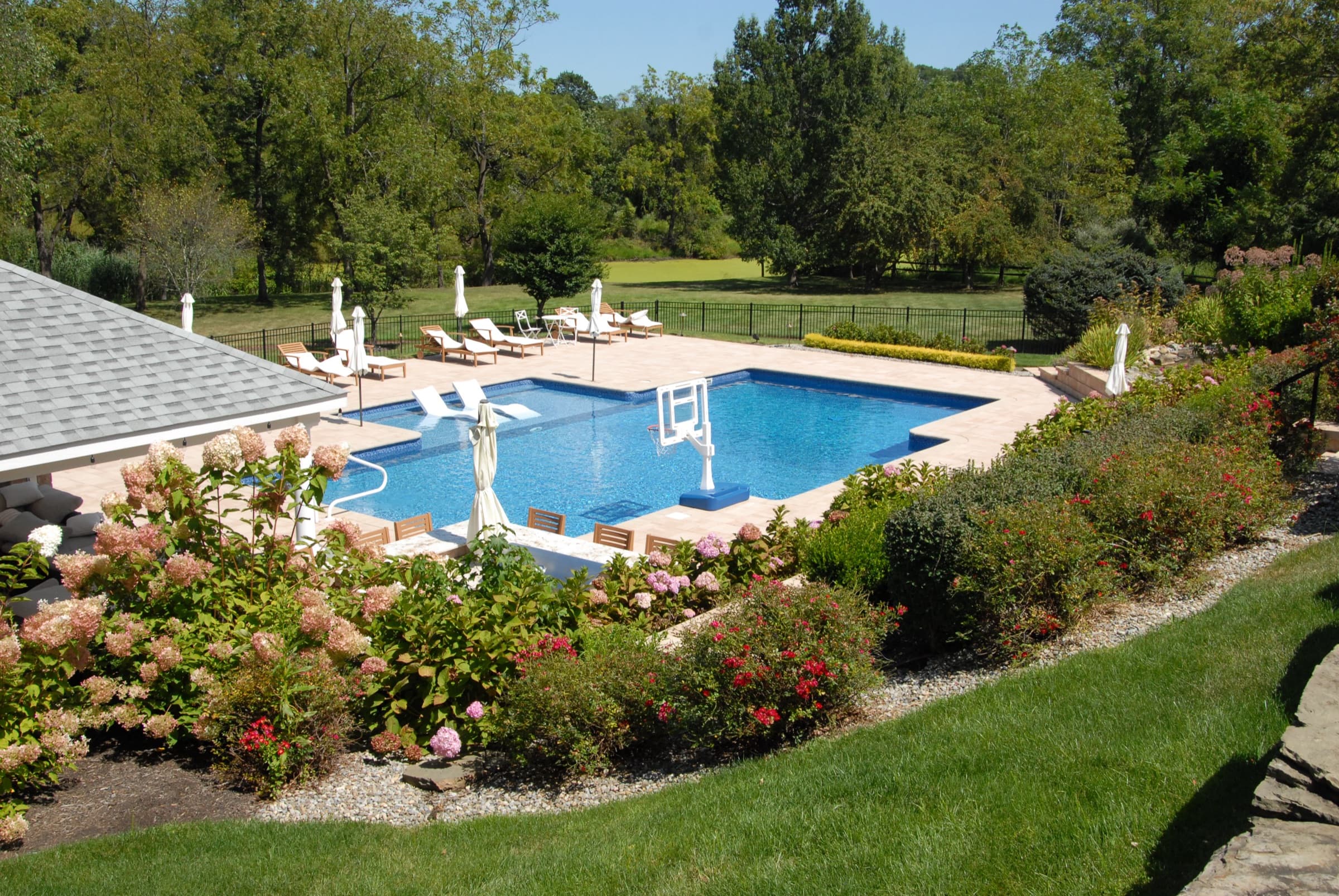 Beautiful backyard pool and patio designed by Seasonal World in Holmdel, NJ
